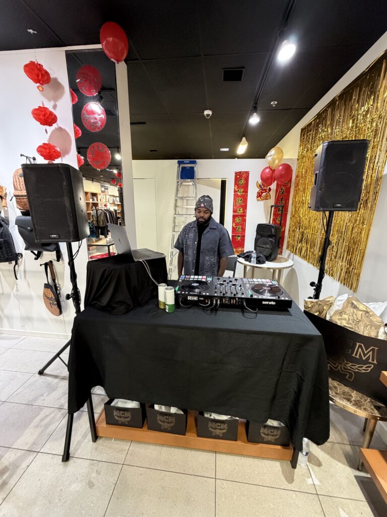 DJ A-Tron on a Rane and Serato setup at the MCM Cabazon Lunar New Year Party, Desert Hills Premium Outlets, February 28, 2026